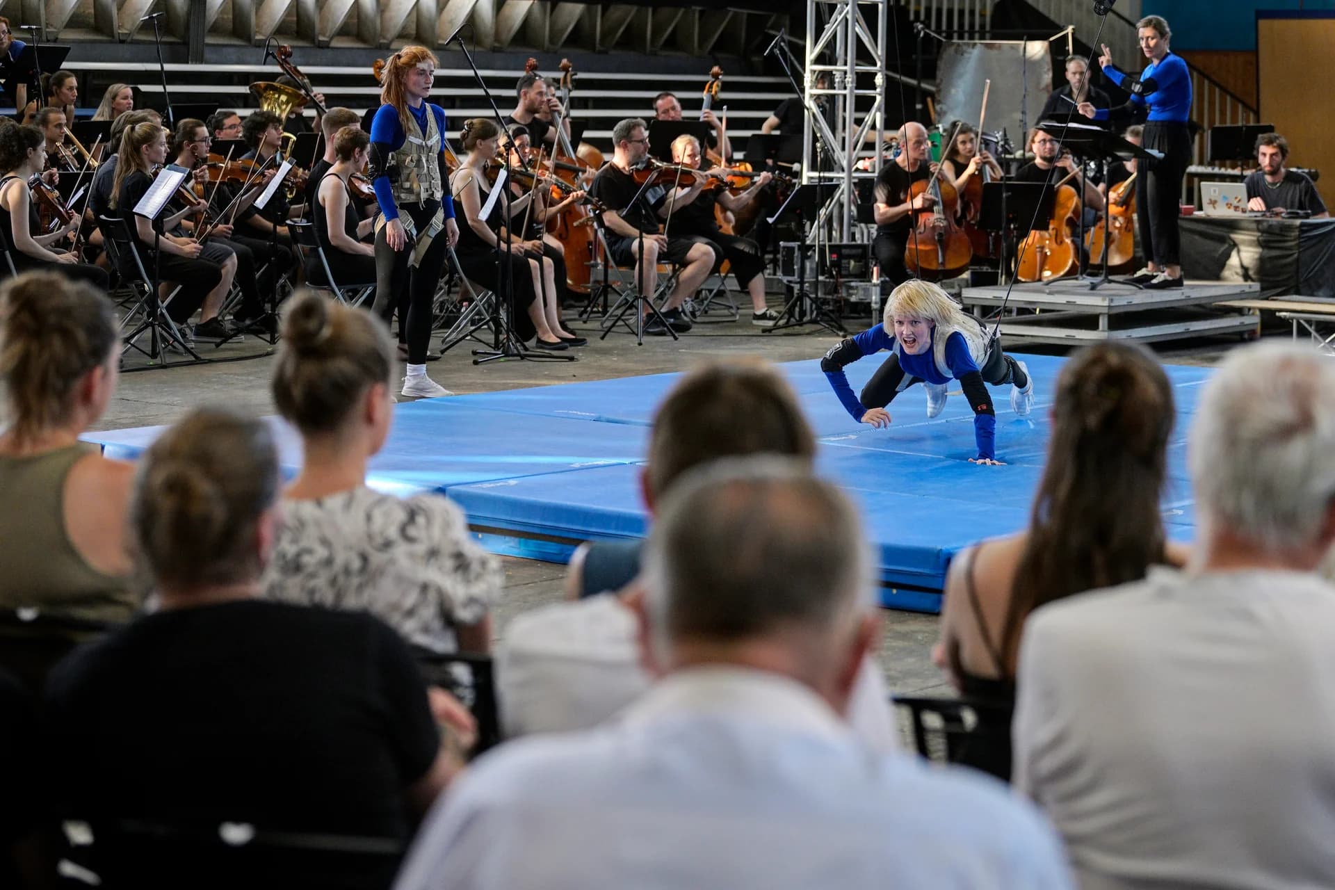IMPACT — close-up of sound equipment and mixing console during live performance.